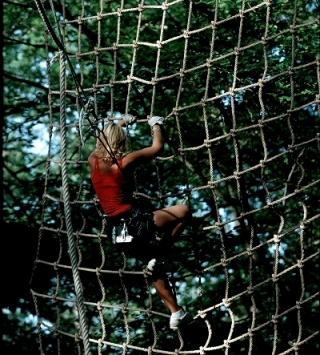  Climb in the nets of the adventure course 